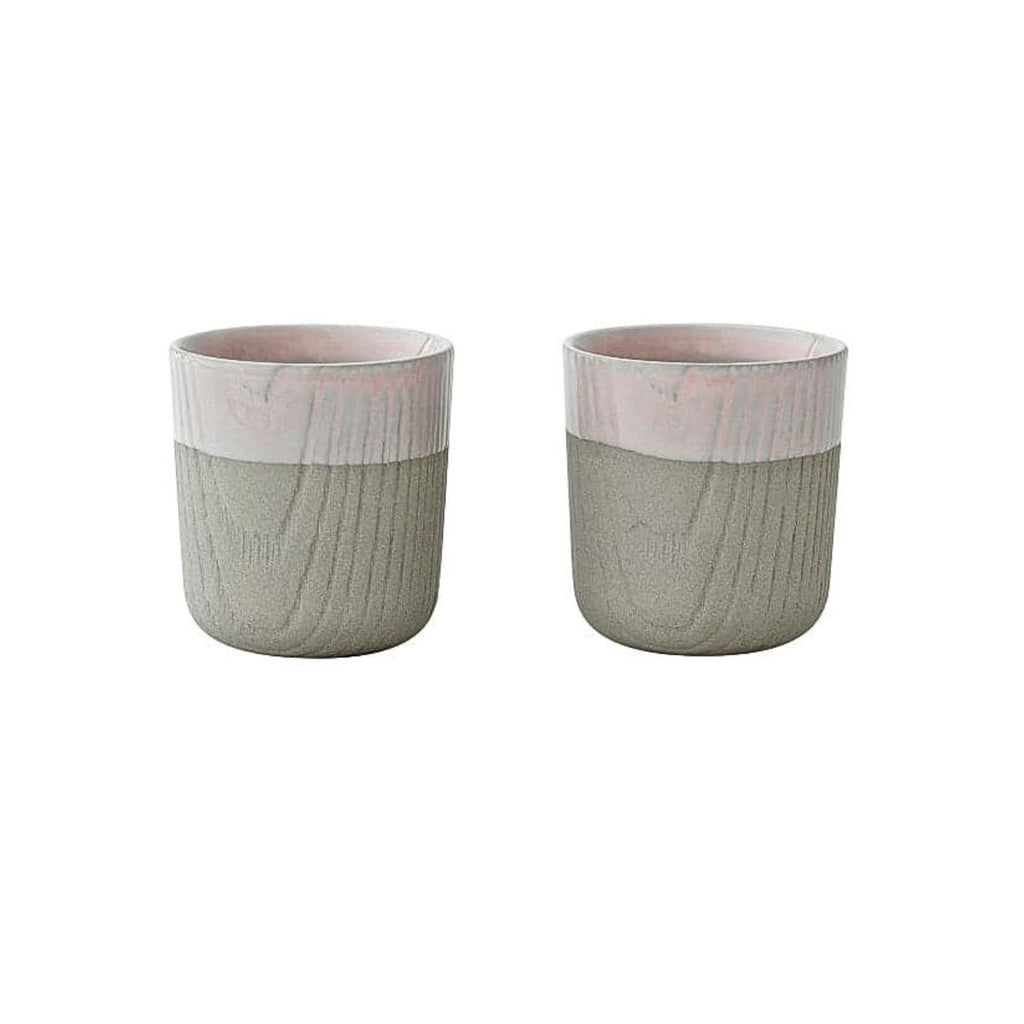 Set of two Toast Living MU mini cups, 80ml, in pale pink with a textured grey lower half and smooth glazed upper finish.