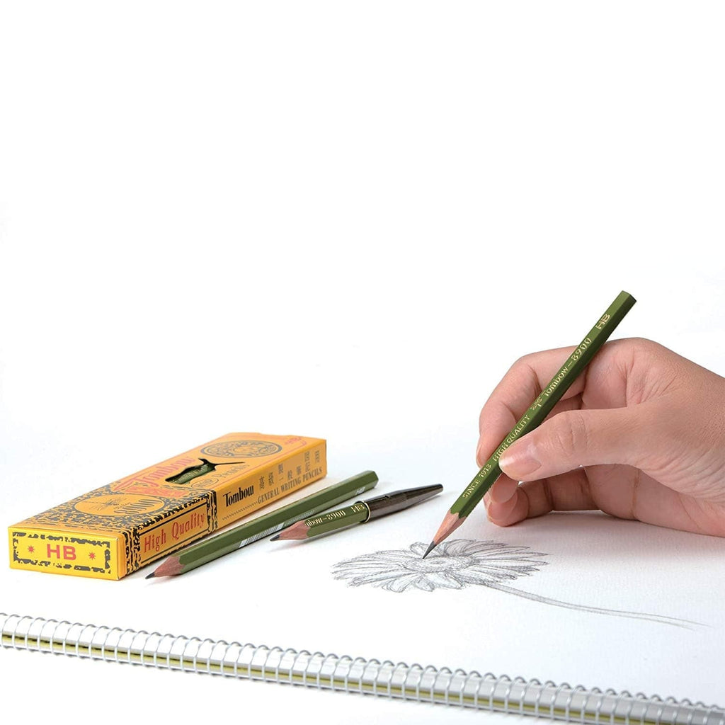A person drawing with the Tombow 8900 pencil, illustrating its ergonomic design.