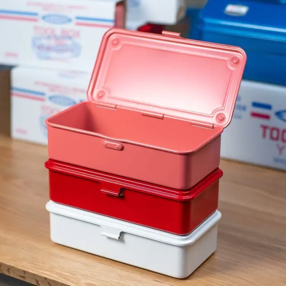 Stack of three TOYO T-190 toolboxes in coral, red, and white with the top box open, revealing its interior.