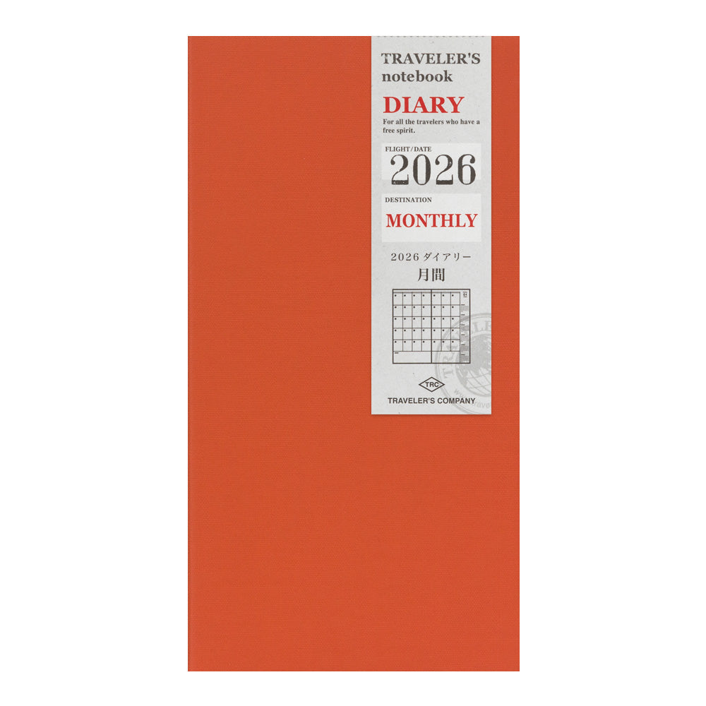 Front cover of Traveler’s Notebook 2026 Monthly Diary Refill Regular Size in orange with label band.