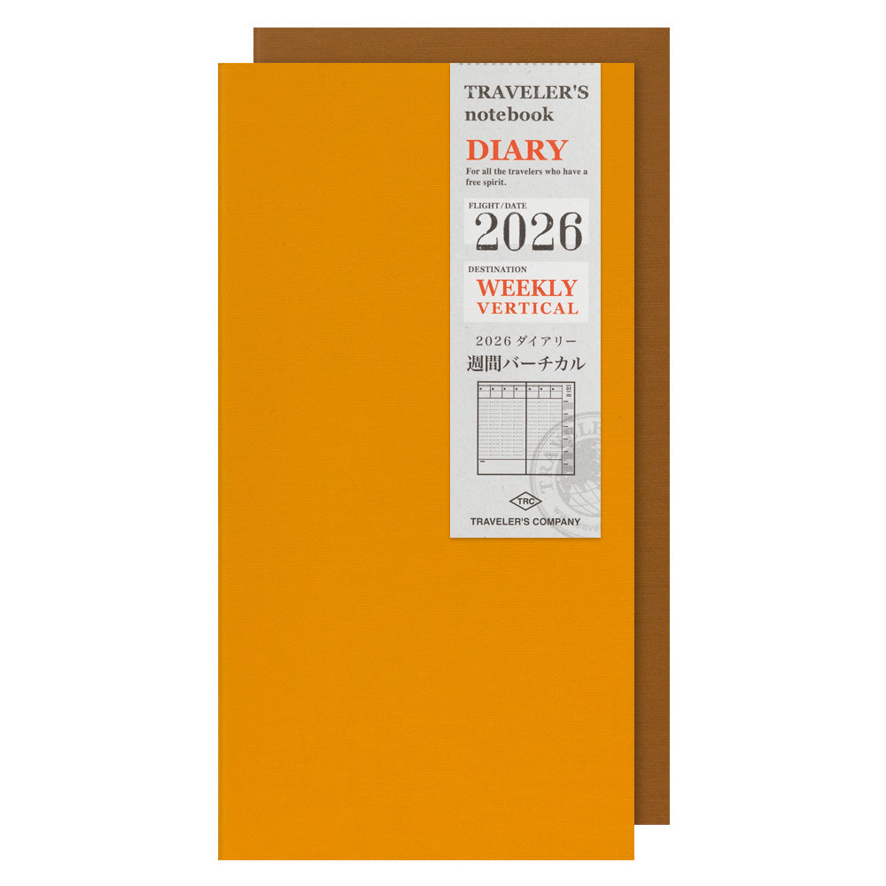 Front cover of Traveler’s Notebook 2026 Weekly Vertical Diary Refill Regular Size, set of two in mustard yellow with silver label band.