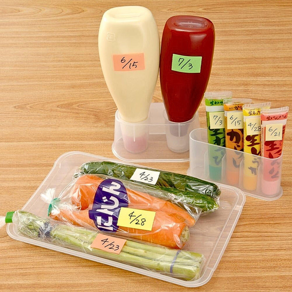 Kitchen condiments and storage containers labelled using coloured tape from the Yamato dispenser.