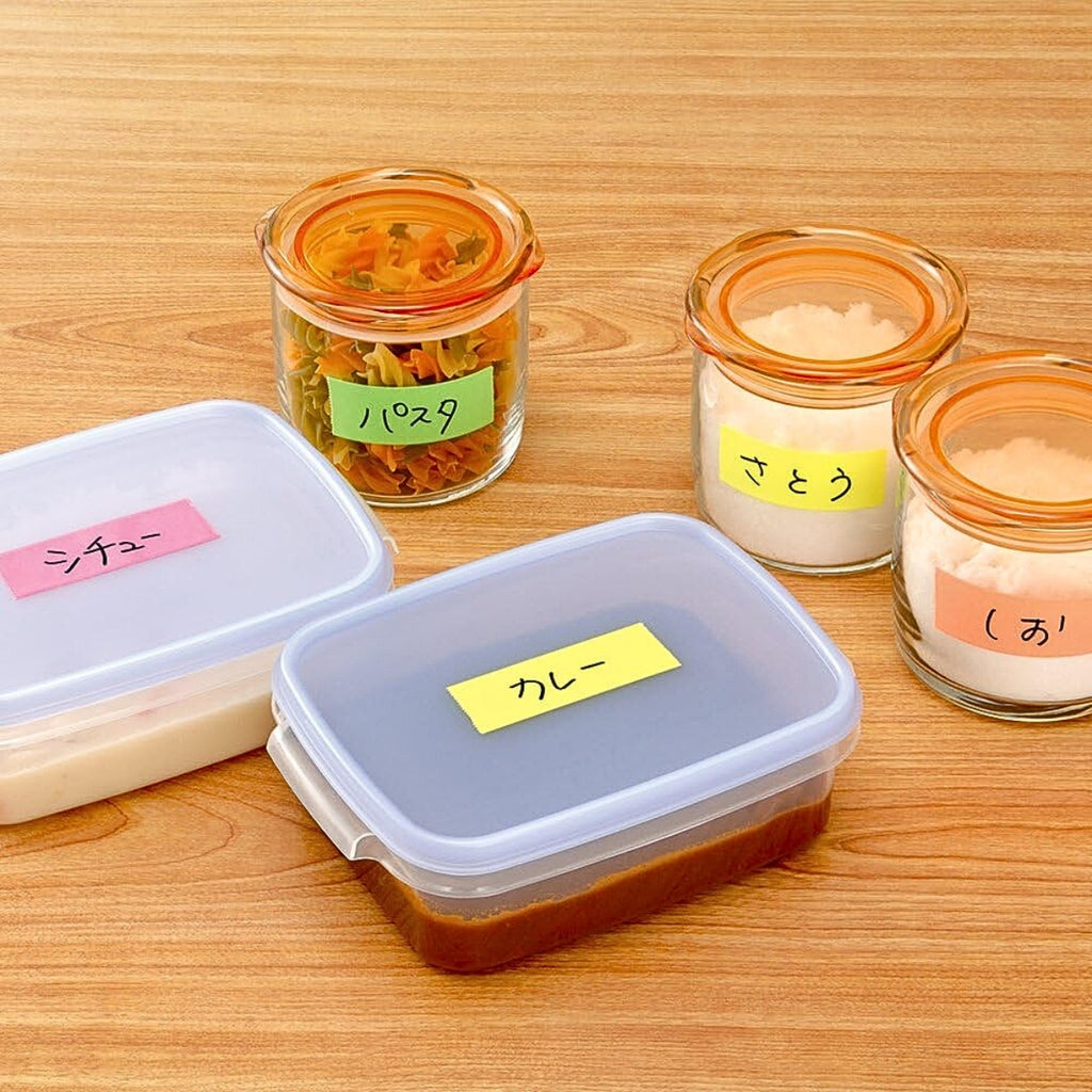 Food storage containers and jars labelled with coloured tape produced by the Yamato tape dispenser