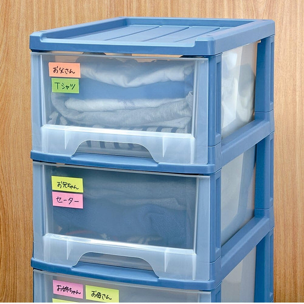 Stacked blue storage drawers labelled neatly with coloured tape from the Yamato Double Roll Tape Dispenser