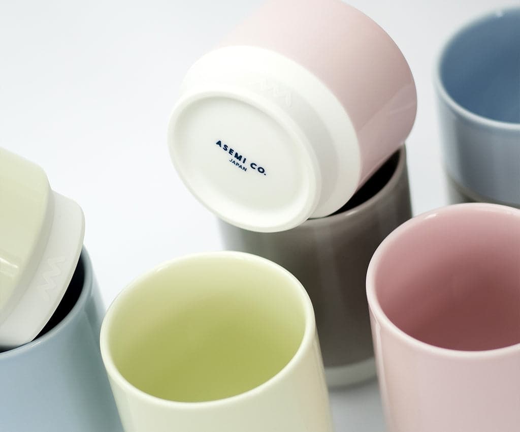 Asemi Hasami large cups in light green shown with other colour variants, highlighting the glazed interiors.