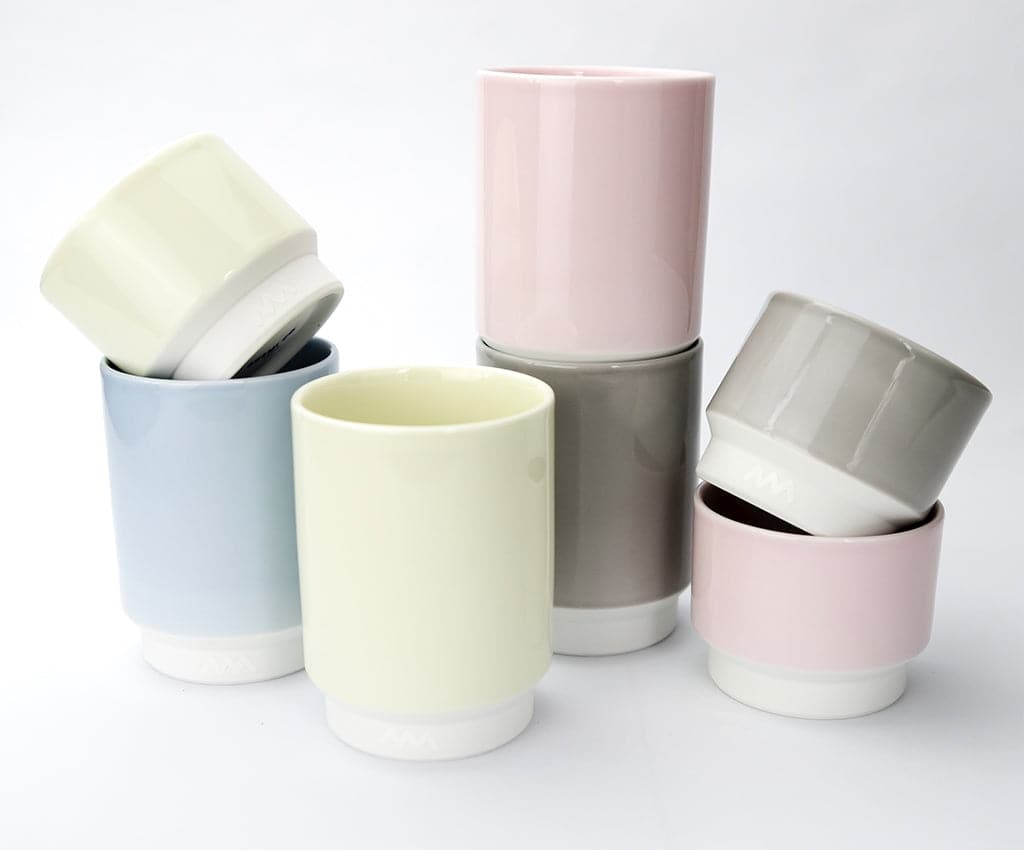 Asemi Hasami small cups in light blue shown with other colour variants, highlighting the glazed interiors.
