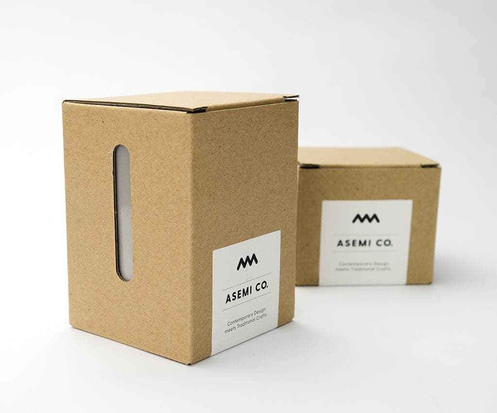 Asemi Hasami small light pink cups displayed alongside their cardboard packaging.