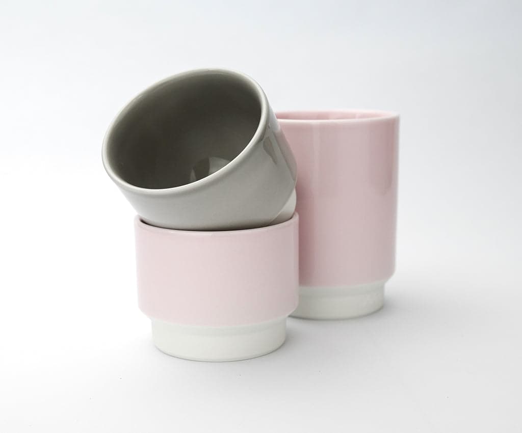 Pair of Asemi Hasami small cups in light pink placed side by side on a clean white background.