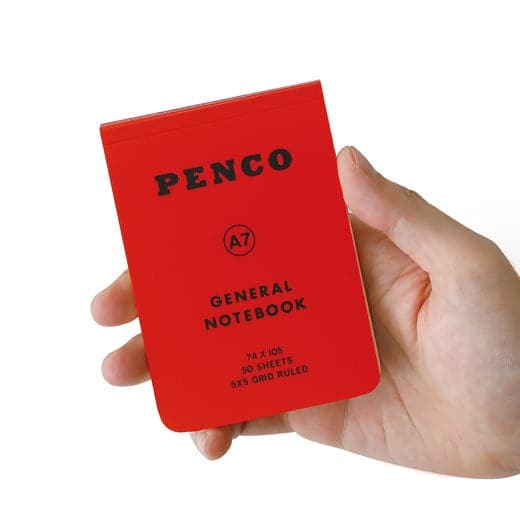 Hightide Penco Soft PP Reporter Notebook A7 in red held upright in one hand.